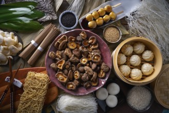Shiitake rice dumplings steamed pork buns noodles Asian cuisine food mix