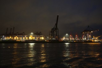 Illuminated container terminal with cranes in the Port of Hamburg, night shot, Hanseatic City of