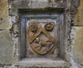 View of coat of arms at a gate, Vicars Close, Wells, Somerset, UK