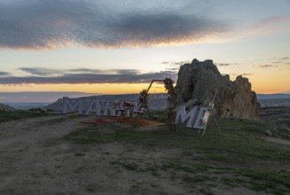 A picture of the Marry Me sign atop Love Valley, part of the Goreme Historical National Park, at