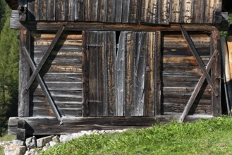 An old wooden hay shed in Val di Morins, the Dolomite Alps of South Tirol
