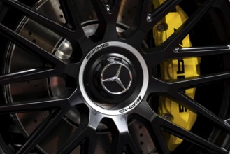 Sofia, Bulgaria - 3 June, 2022: Close-up of Mercedes-Benz logo is seen on a wheel of a car with