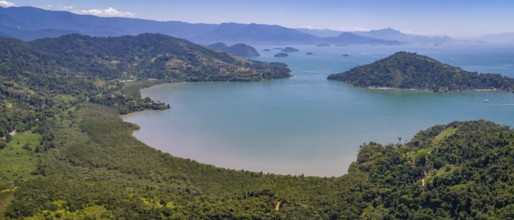 Aerial view panorama of a fantastic bay and islands with Atlantic forest near Tarituba, Green