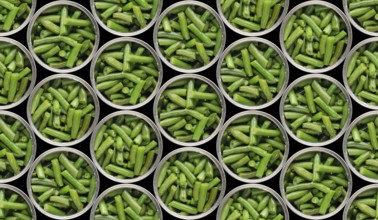 Seamless food background of flat lay view at opened tin cans with green beans isolated on black