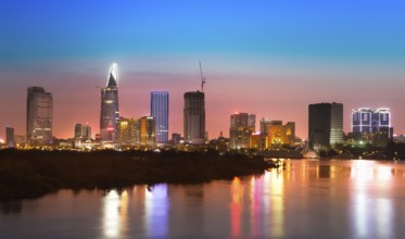 Saigon skyline with river after sunset, Vietnam, Asia
