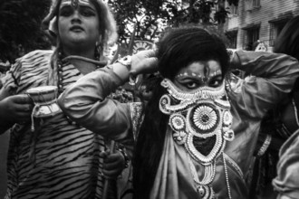 Men in fancy dress in Charak Festival parade, Kolkata, West Bengal, India, Asia