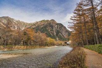 Nature landscape at Kamikochi Japan, autumn foliage season with pond and mountain