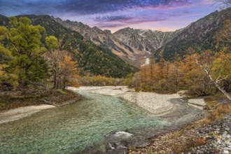Nature landscape at Kamikochi Japan, autumn foliage season with pond and mountain