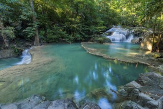 Erawan Waterfall with fish in water in Kanchanaburi Province, Thailand, Asia