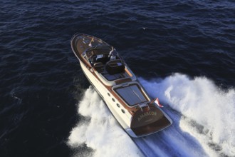 Aerial view sports boat J Craft 42 Torpedo R at full speed on the Cote d'Azur, luxurious motorboat