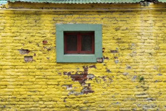 Colourful wall with windows in the La Boca district, Buenos Aires Argentina