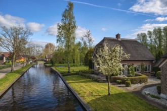 Giethoorn Netherlands, city skyline at canal and traditional house in Giethoorn village