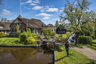 Giethoorn Netherlands, city skyline at canal and traditional house in Giethoorn village with