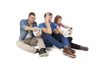 Three young friends ar gaming with the computer