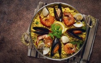 Paella, traditional Spanish dish, seafood paella, top view, homemade, no people