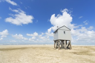 Drowning house at the beach from Dutch wadden island Terschelling