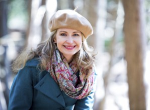 Blond casual woman happy outdoors in the woods, Toronto, Canada, North America
