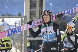 Marius Lindvik (Norway/NOR) on his way to the ski jump during the qualification for the opening ski