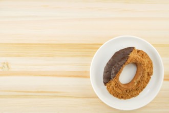 Chocolate donut placed in a dish. Shooting Location: Yokohama-city kanagawa prefecture