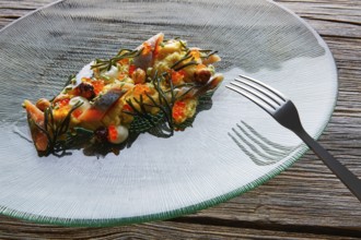 Smoked sardines salad with creamy cheese corn codium and hazelnuts
