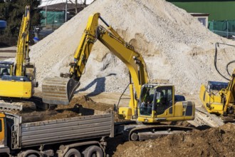 Excavator on a building site. Excavator shovel with earth, earthworks. Austria