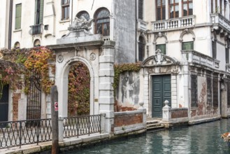 Entrance of an old baroque Palace in Dorsoduro Quarter, Venice, Italy, Europe