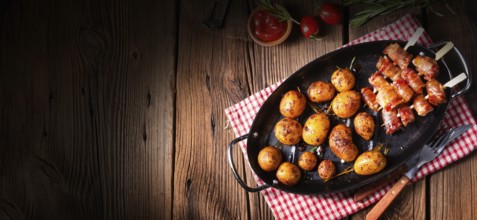 Rustic dates wrapped in bacon and young roasted potato