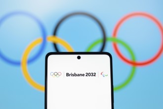 In this photo illustration, the 2032 Summer Olympics Games, Brisbane 2032 logo is displayed on a