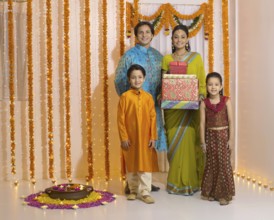 Woman holding gift box with family MR#779P, MR#779Q, MR#779R, MR#779S