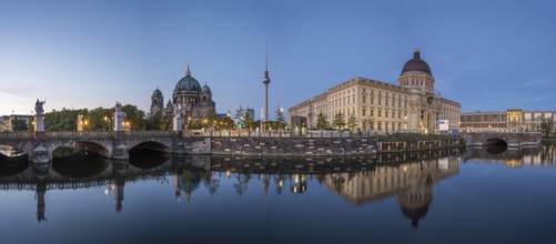 Panorama of Berlin Cathedral, the famous television tower and the rebuilt City Palace at dusk
