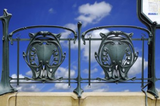 Railing of a Paris metro station with typical floral Art Nouveau elements. Landscape format.