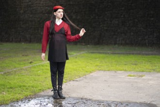Transgender woman posing sensually in a park