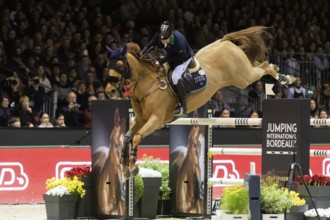Denis Lynch of Ireland competes in the equestrian Audi Grand Prix at Jumping International