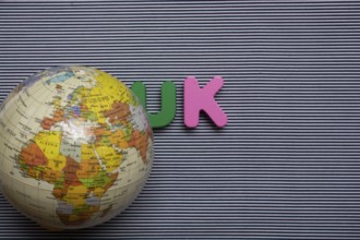 Abbreviation of united kingdom UK on wood background