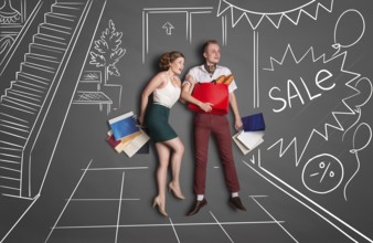 Love story concept of romantic couple shopping against chalk drawings background. Young happy