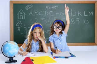 Smart nerd student in classroom raising hand with sad friend