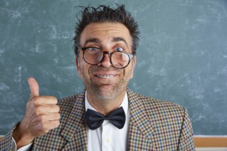 Nerd silly retro teacher man with braces funny expression ok thumb up gesture