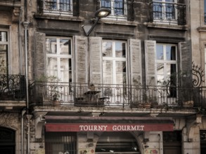 Residential flats sit above a restaurant in a multi use building in Bordeaux, France, Europe