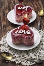 Cake with fruit filling in the shape of heart with the inscription love