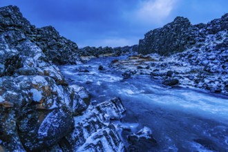 Gravel road and blue river. Shooting Location: Iceland