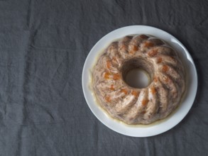Homemade delicious jelly meat on table with dark gray linen tablecloth. Perfect jellied meat,