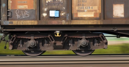 The wagons of a goods train on railway tracks. Environmentally friendly transport of goods Austria