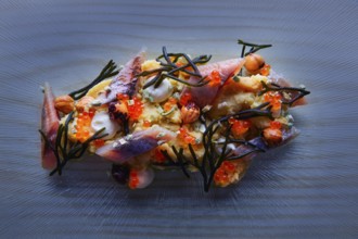 Smoked sardines salad with creamy cheese corn codium and hazelnuts