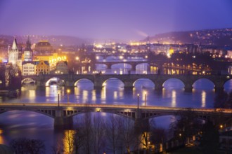 Vltava (Moldau) River at Prague with Charles Bridge at dusk, Czech Republic, Europe
