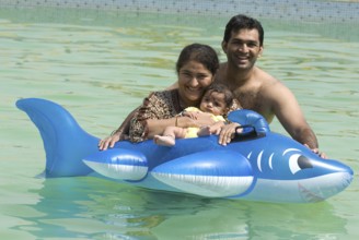 Family enjoying in swimming pool at Uttan near Bhayander west Maharashtra India Asia MR 721W
