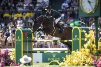 Harrie Smolders of The Netherlands and riding Uricas V/D Kattevennen compete in the first round of