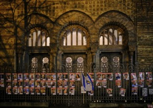 Germany, Berlin, 19 December 2024, Photos of Hamas hostages, fence in front of the New Synagogue,