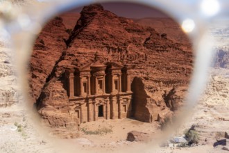 View on the monastery of Petra through the tainted glass of a sunglasses. Creative image