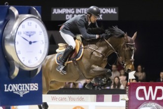 Harrie Smolders of the Netherlands competes in the equestrian Audi Grand Prix at Jumping