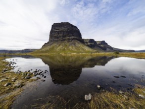 Rock massif Lomagnupur or Lómagnúpur, reflection in a pond, South Iceland, Iceland, Europe